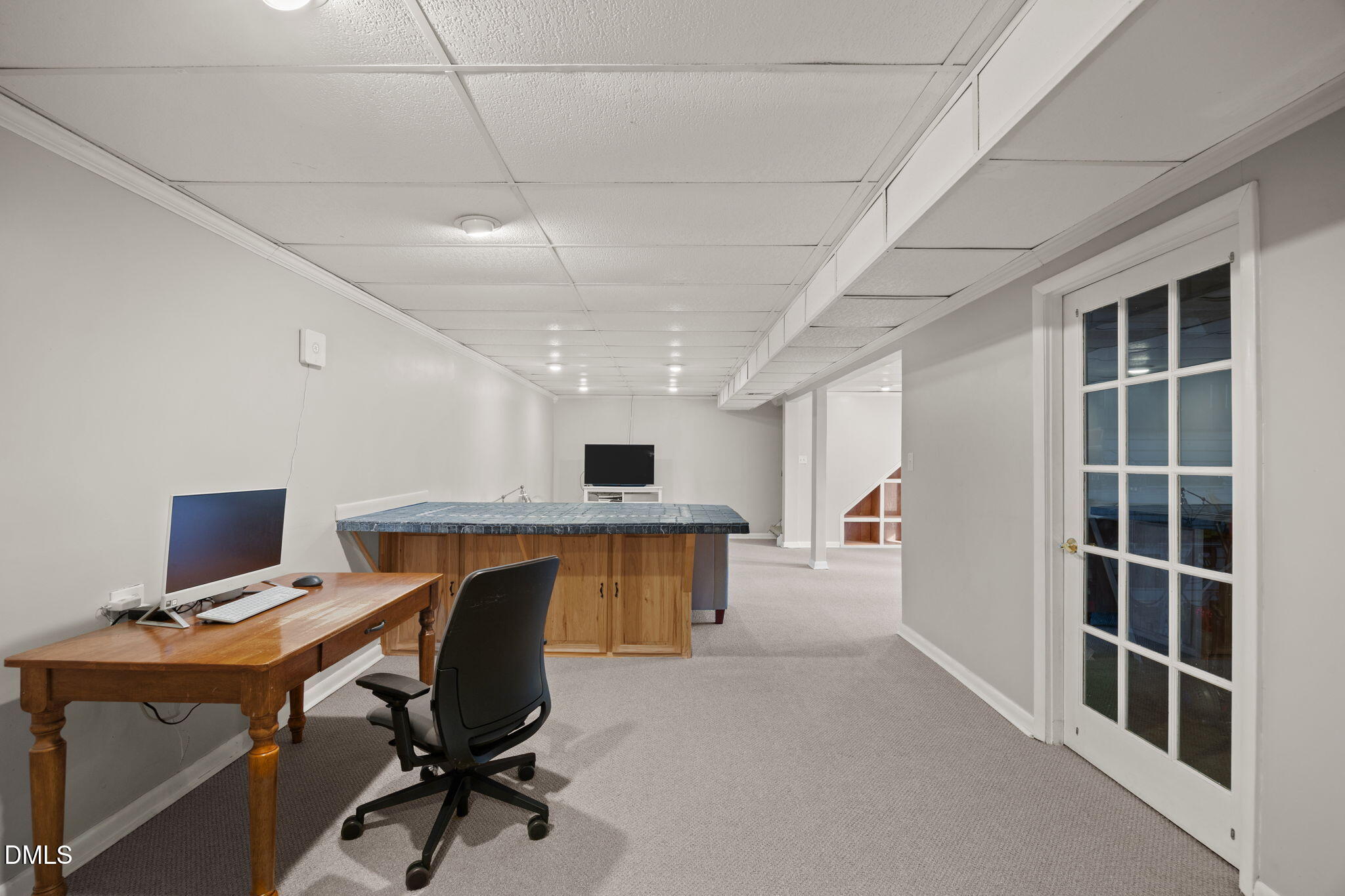 4828 Latimer Road Raleigh, NC 27609 - Photo 28 of 47 a view of a workspace with furniture and a window