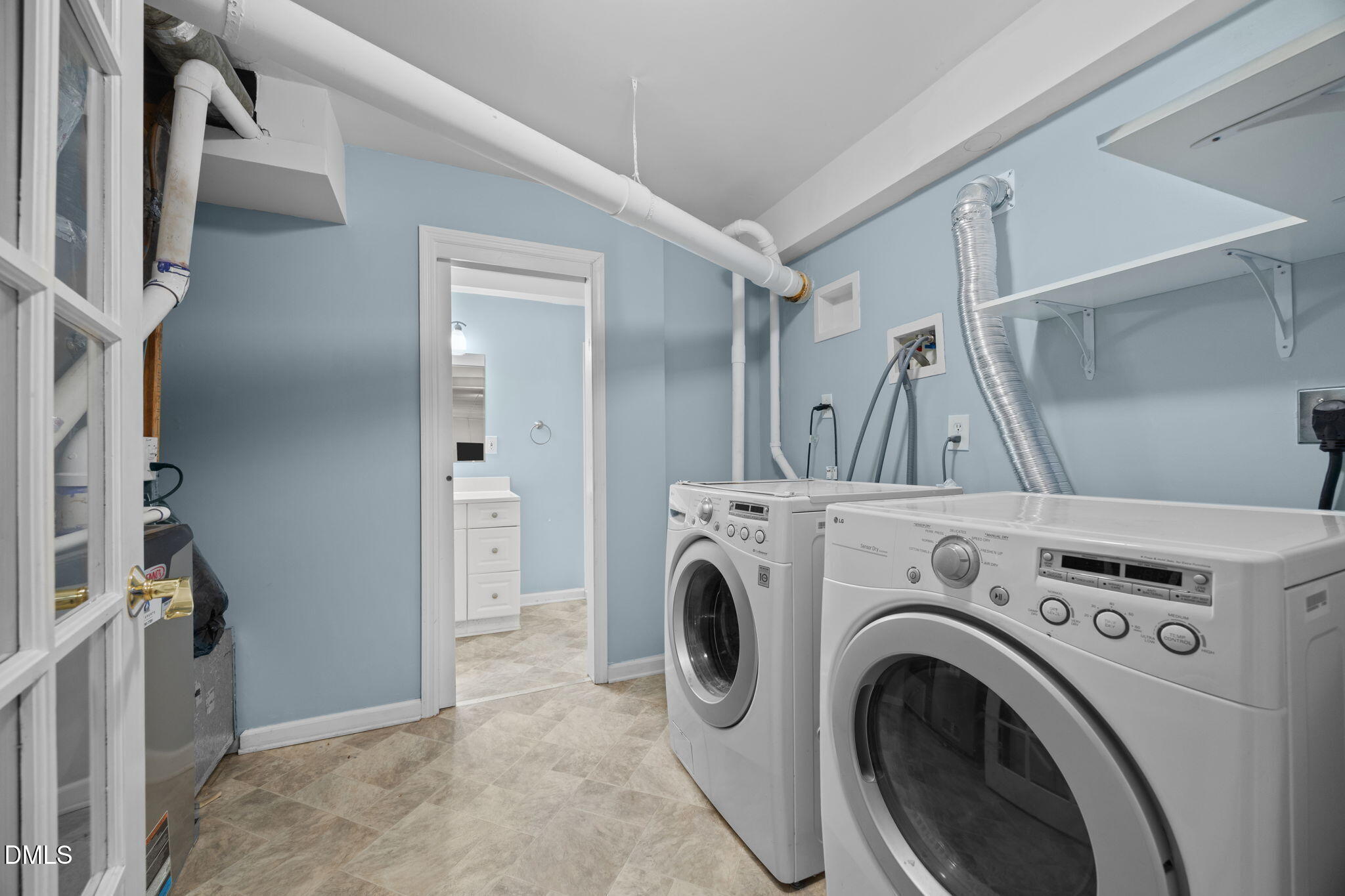 4828 Latimer Road Raleigh, NC 27609 - Photo 29 of 47 a view of hallway with washer and dryer