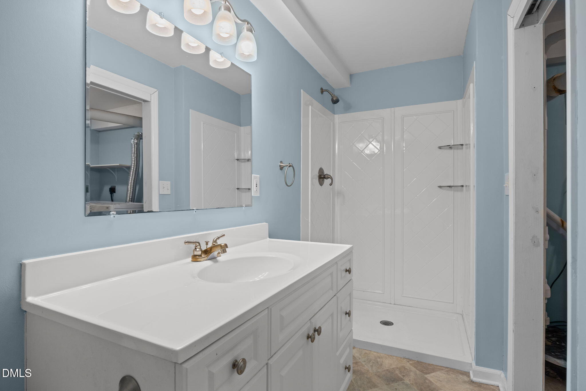 4828 Latimer Road Raleigh, NC 27609 - Photo 30 of 47 a bathroom with a sink vanity and a mirror