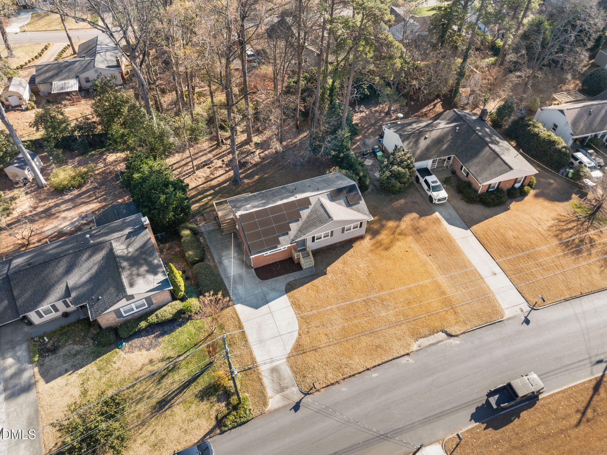 4828 Latimer Road Raleigh, NC 27609 - Photo 44 of 47 an aerial view of a house with roof and wooden fence