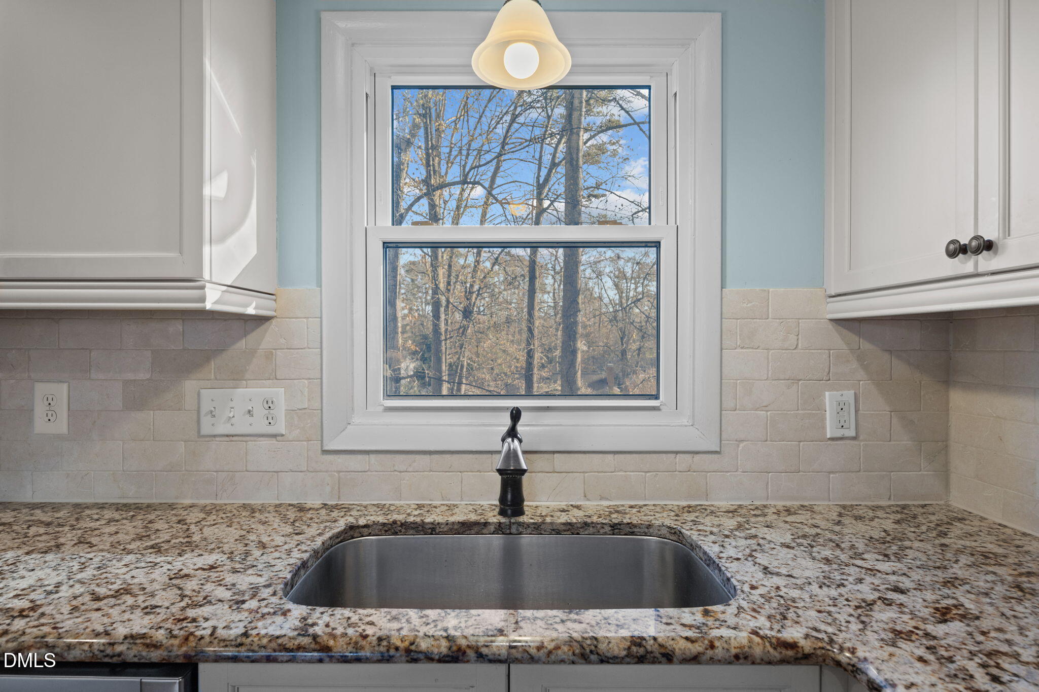 4828 Latimer Road Raleigh, NC 27609 - Photo 9 of 47 a kitchen with sink and window