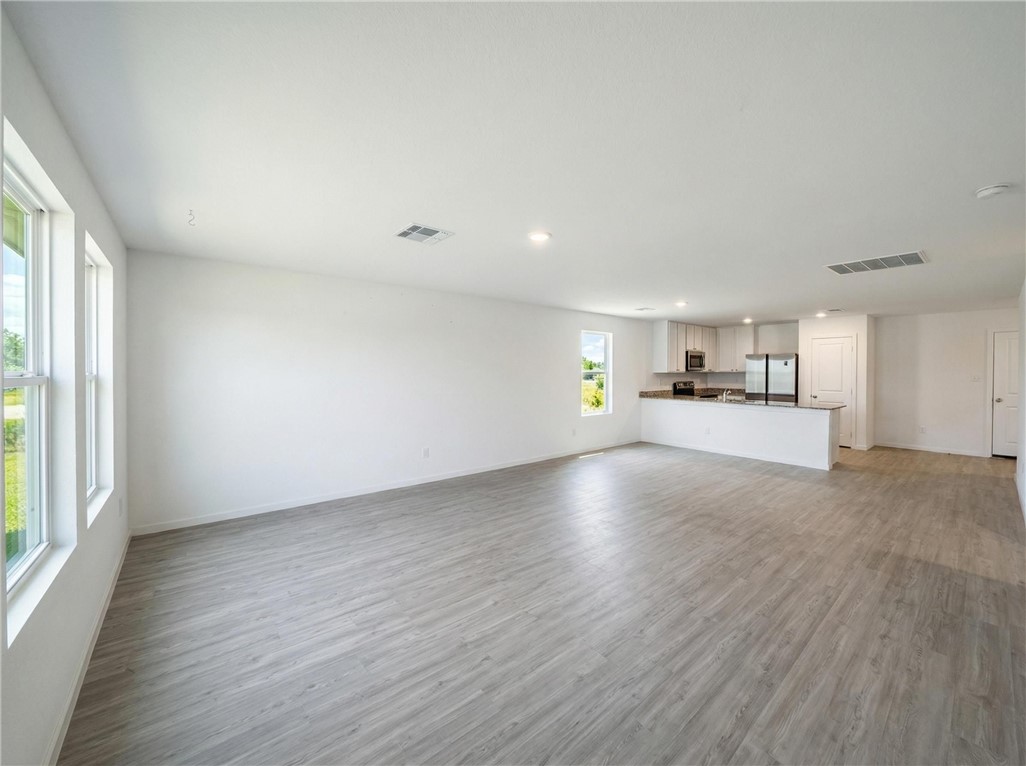 9201 Wilde Way Corpus Christi, TX 78410 - Photo 13 of 21 a view of empty room with kitchen and window