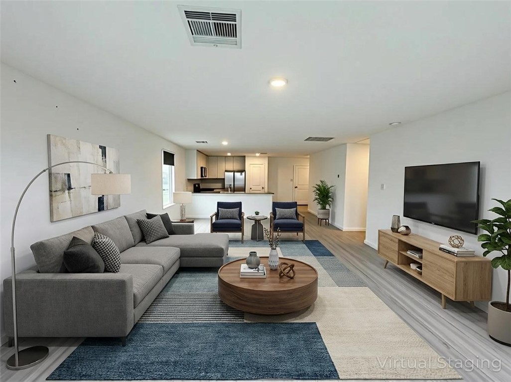 9201 Wilde Way Corpus Christi, TX 78410 - Photo 6 of 21 a living room with furniture and a flat screen tv