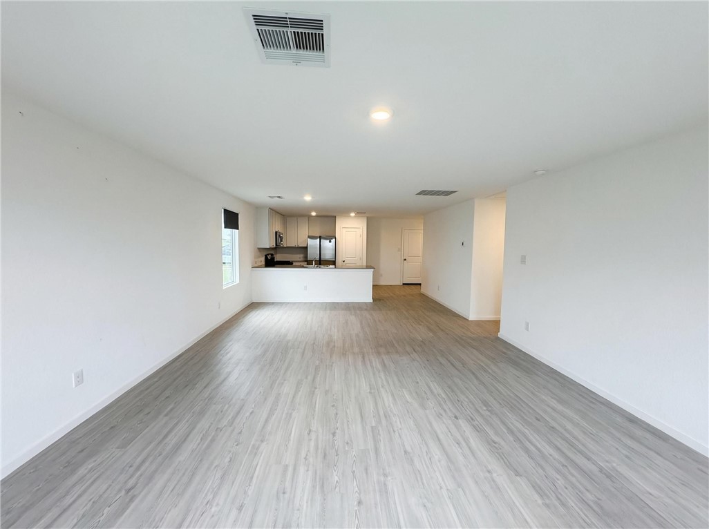 9201 Wilde Way Corpus Christi, TX 78410 - Photo 7 of 21 a view of empty room with wooden floor