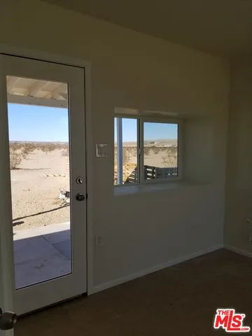a view of an empty room and window