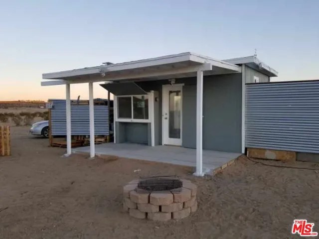a view of an chairs and table in the room