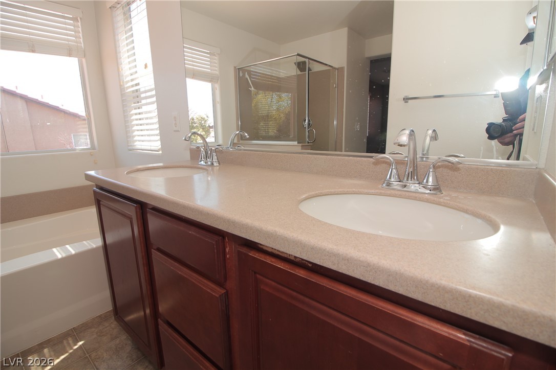 9289 Valley Ranch Avenue Las Vegas, NV 89178 - Photo 17 of 29 Double vanities with ample counter space offer a functional and spacious bathroom.