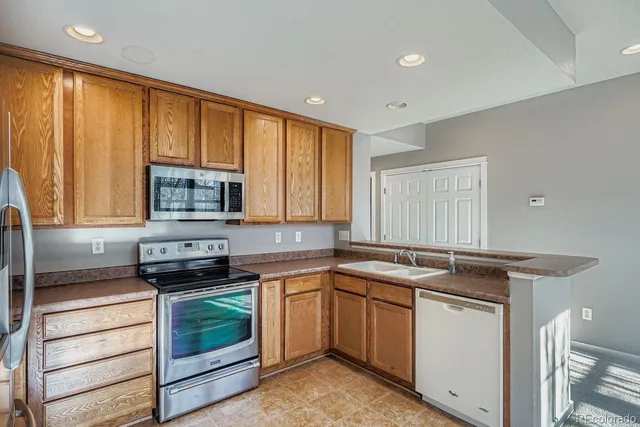 a kitchen that has a sink and a stove