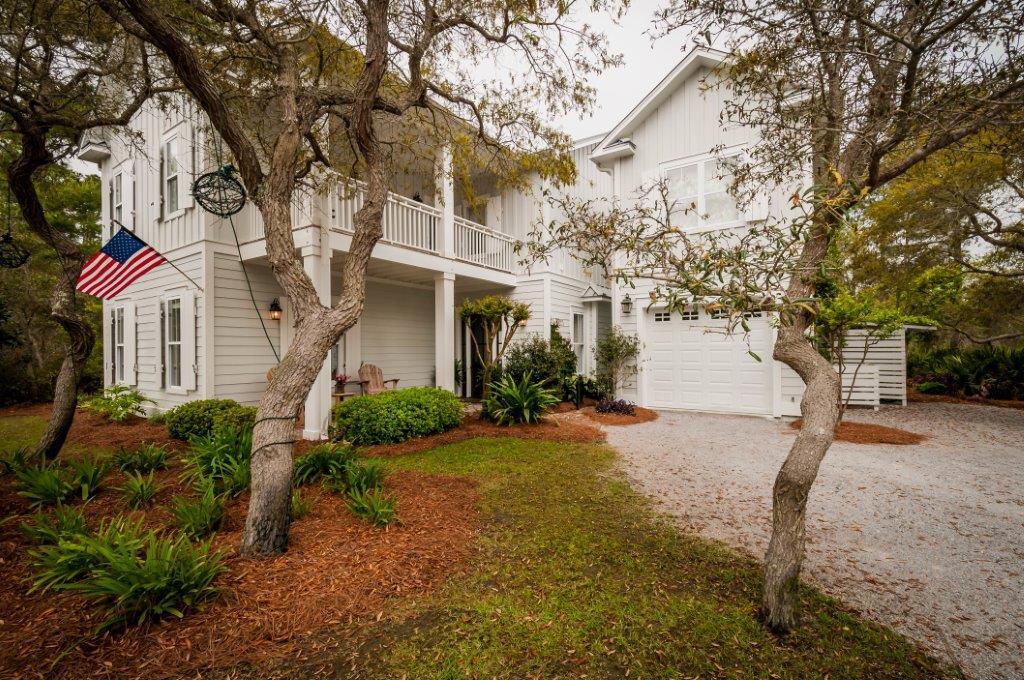 97 Spotted Dolphin Road Santa Rosa Beach, FL 32459 - Photo 1 of 32 a front view of a house with a yard and garage