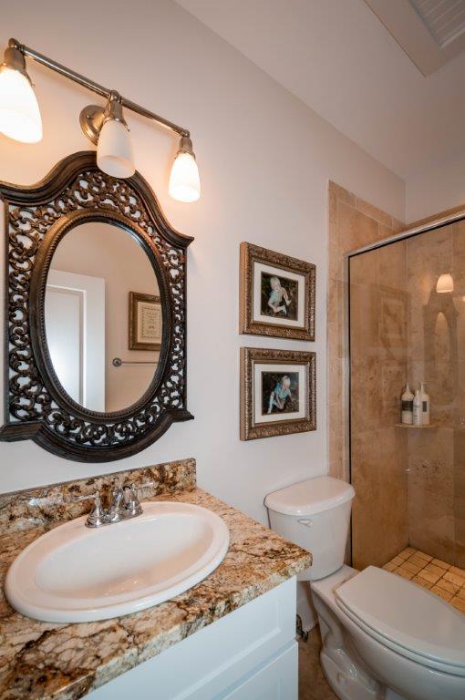 97 Spotted Dolphin Road Santa Rosa Beach, FL 32459 - Photo 21 of 32 a bathroom with a toilet a sink and a mirror