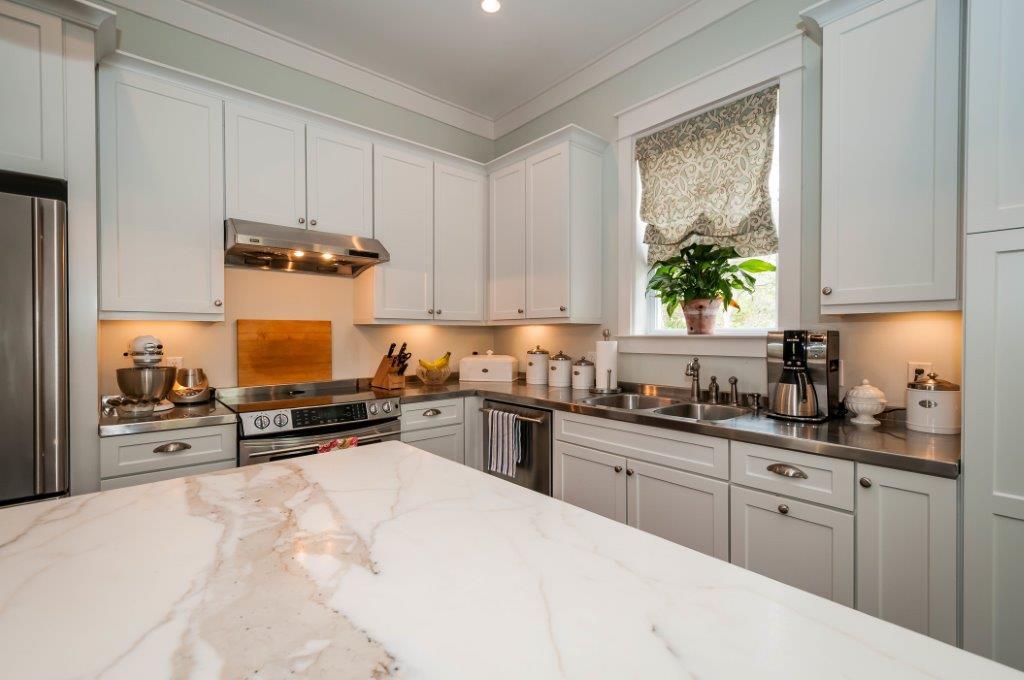 97 Spotted Dolphin Road Santa Rosa Beach, FL 32459 - Photo 5 of 32 a kitchen with kitchen island granite countertop a sink a stove and cabinets