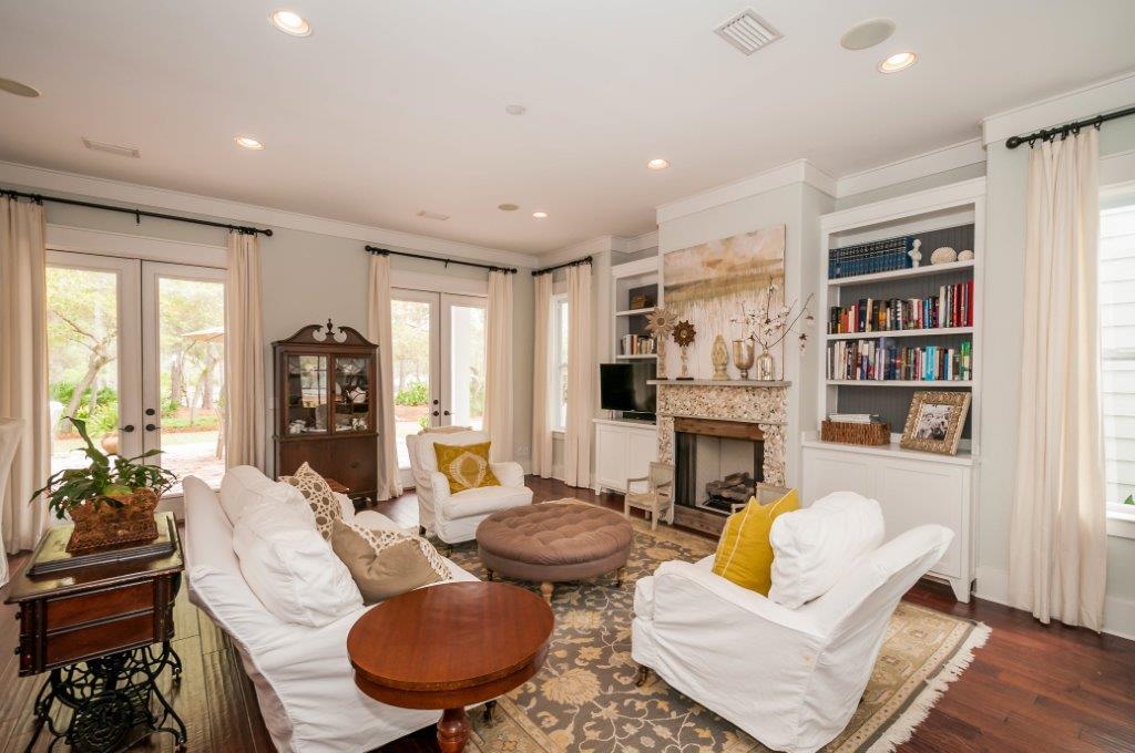 97 Spotted Dolphin Road Santa Rosa Beach, FL 32459 - Photo 7 of 32 a living room with furniture a rug and a bookshelf