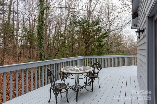 a view of a wooden deck with furniture