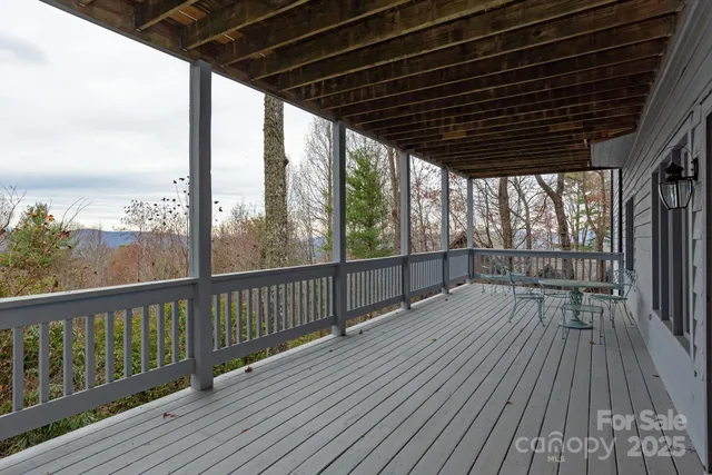 a view of porch with wooden floor in outdoor space