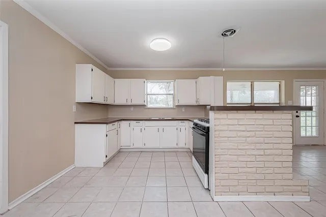 a kitchen with a cabinets and appliances
