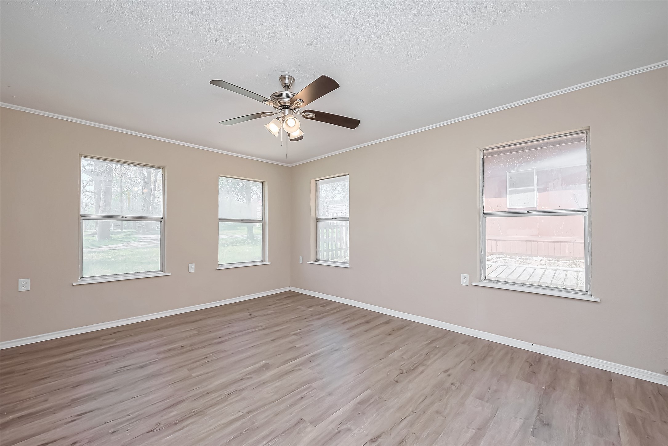 14 Veronica Lane Huntsville, TX 77340 - Photo 16 of 50 a view of an empty room with a window and wooden floor