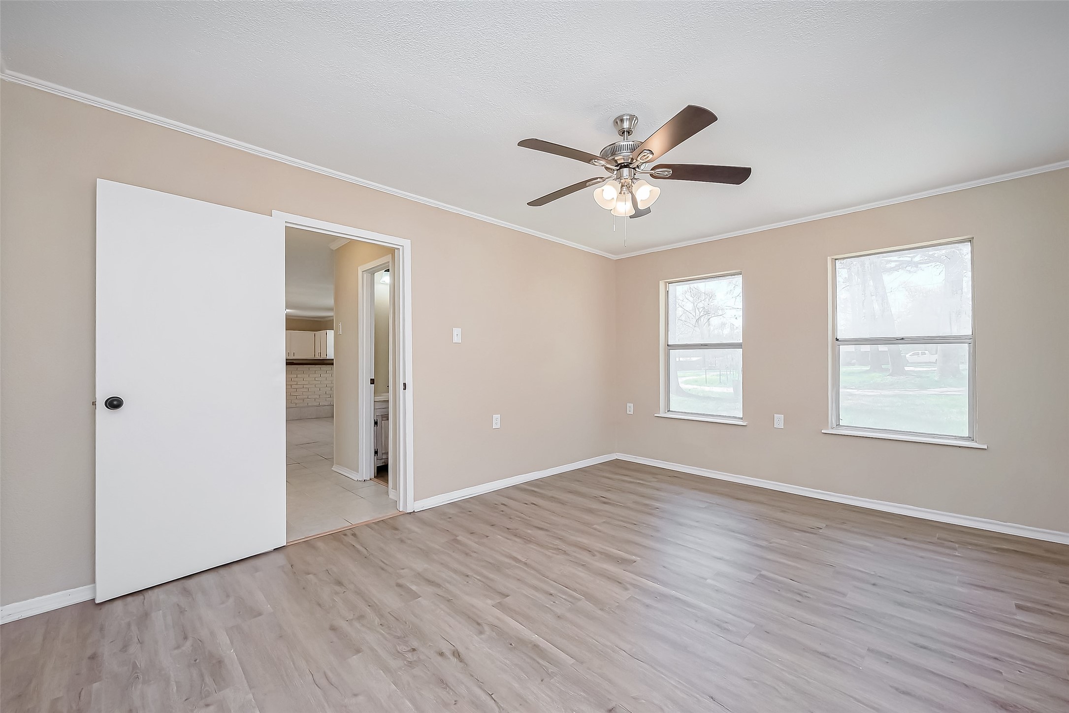 14 Veronica Lane Huntsville, TX 77340 - Photo 19 of 50 a view of empty room with wooden floor and fan