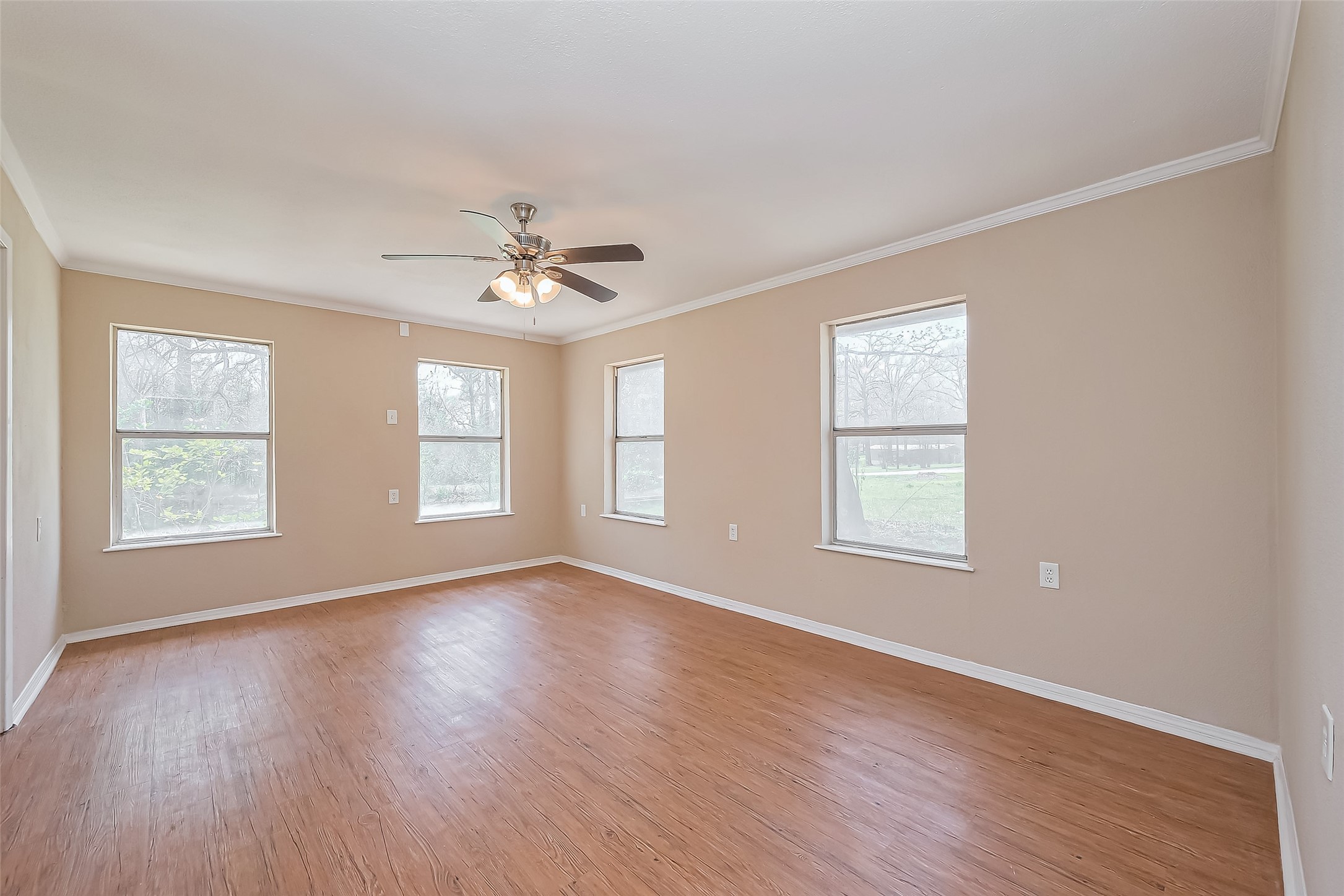 14 Veronica Lane Huntsville, TX 77340 - Photo 23 of 50 an empty room with wooden floor and windows