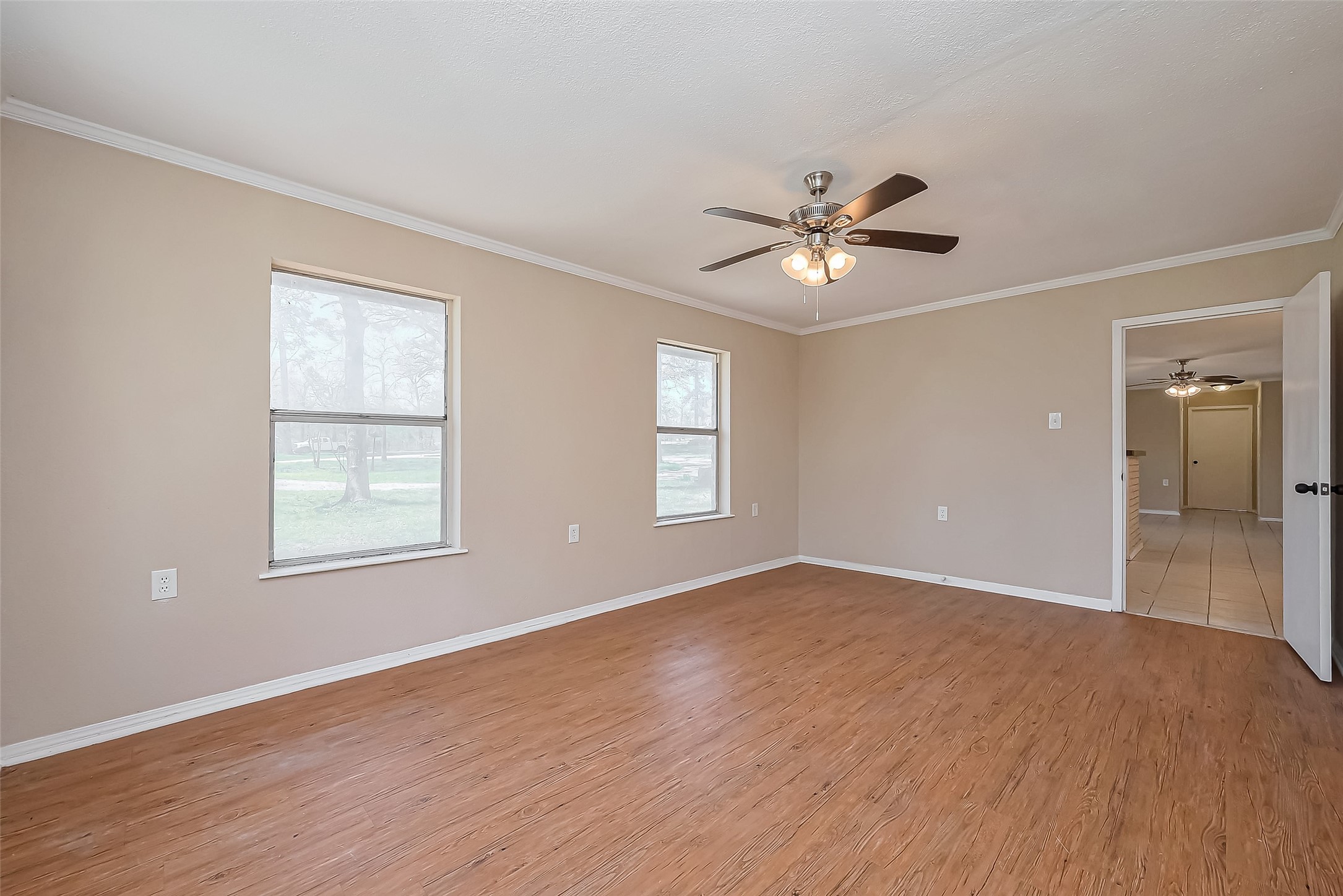 14 Veronica Lane Huntsville, TX 77340 - Photo 24 of 50 a view of an empty room with a window and a ceiling fan