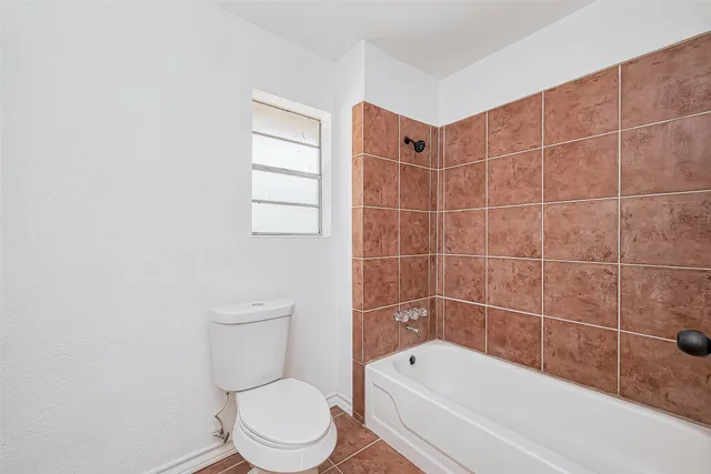 a kitchen with cabinets appliances