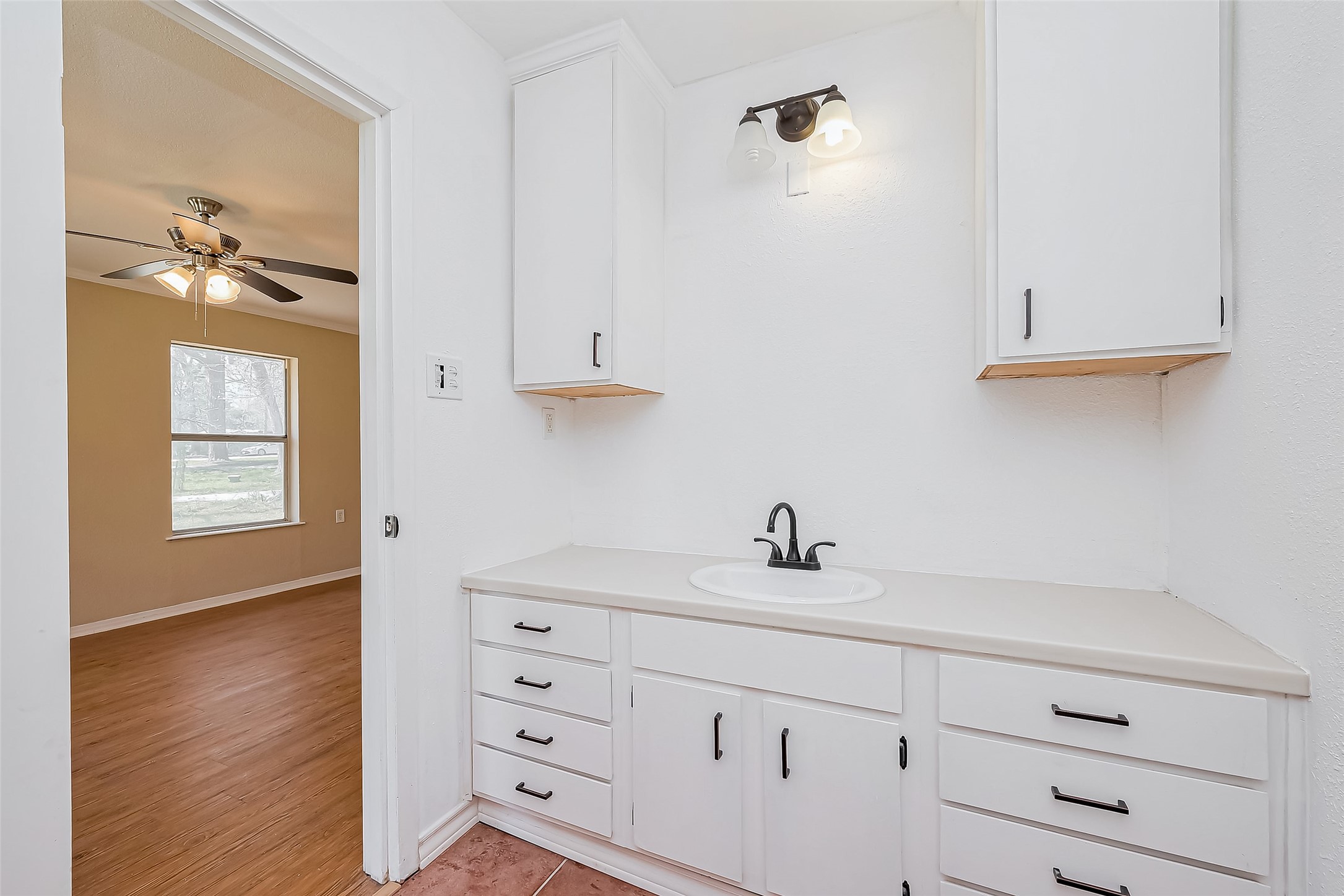 14 Veronica Lane Huntsville, TX 77340 - Photo 29 of 50 a bathroom with a sink a mirror and a vanity