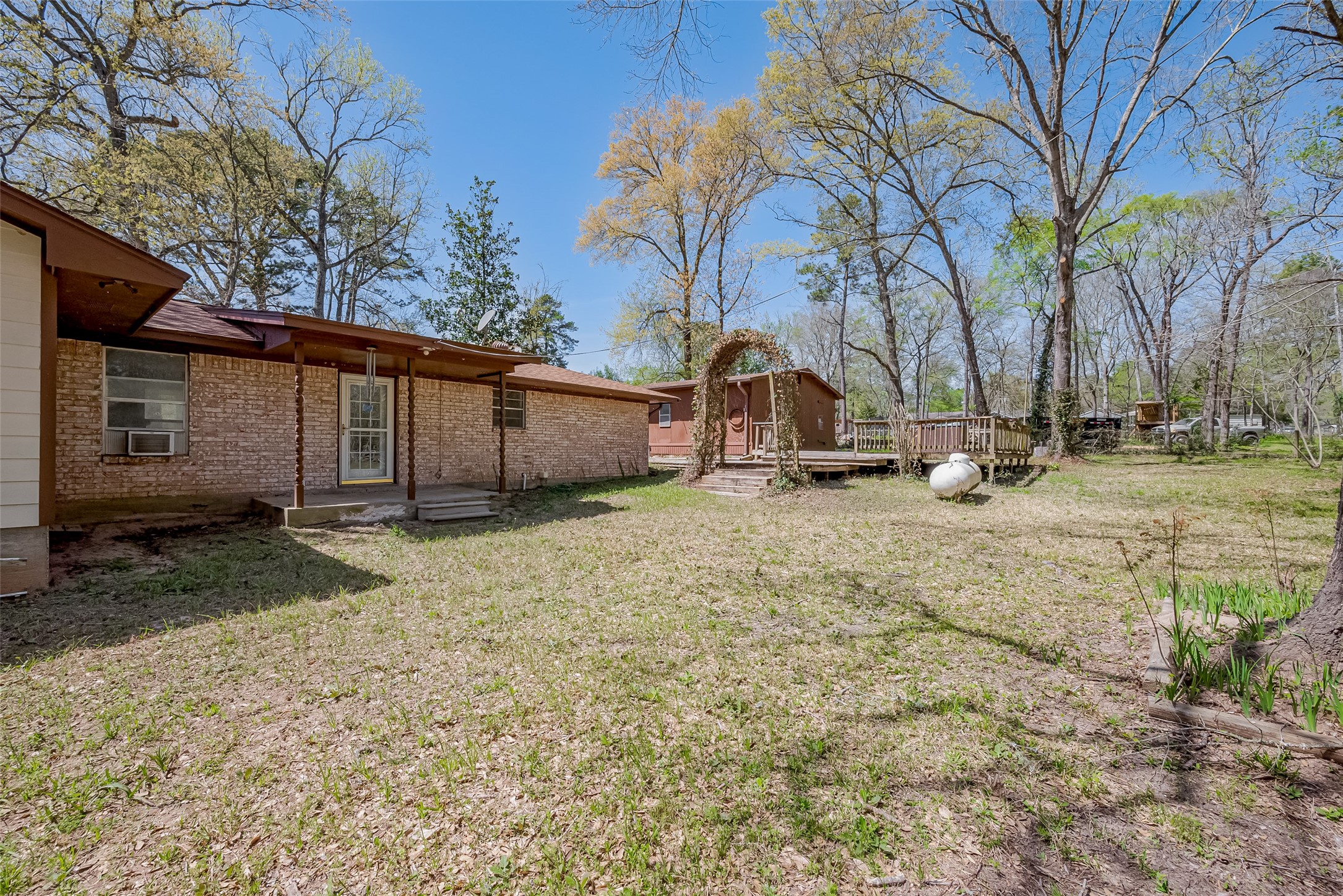 14 Veronica Lane Huntsville, TX 77340 - Photo 34 of 50 a view of backyard with large trees