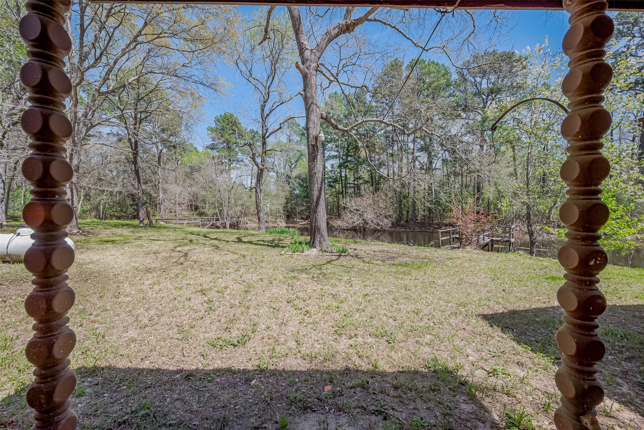 14 Veronica Lane Huntsville, TX 77340 - Photo 36 of 50 a backyard of a house with lots of green space