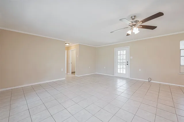 a view of an empty room with a window