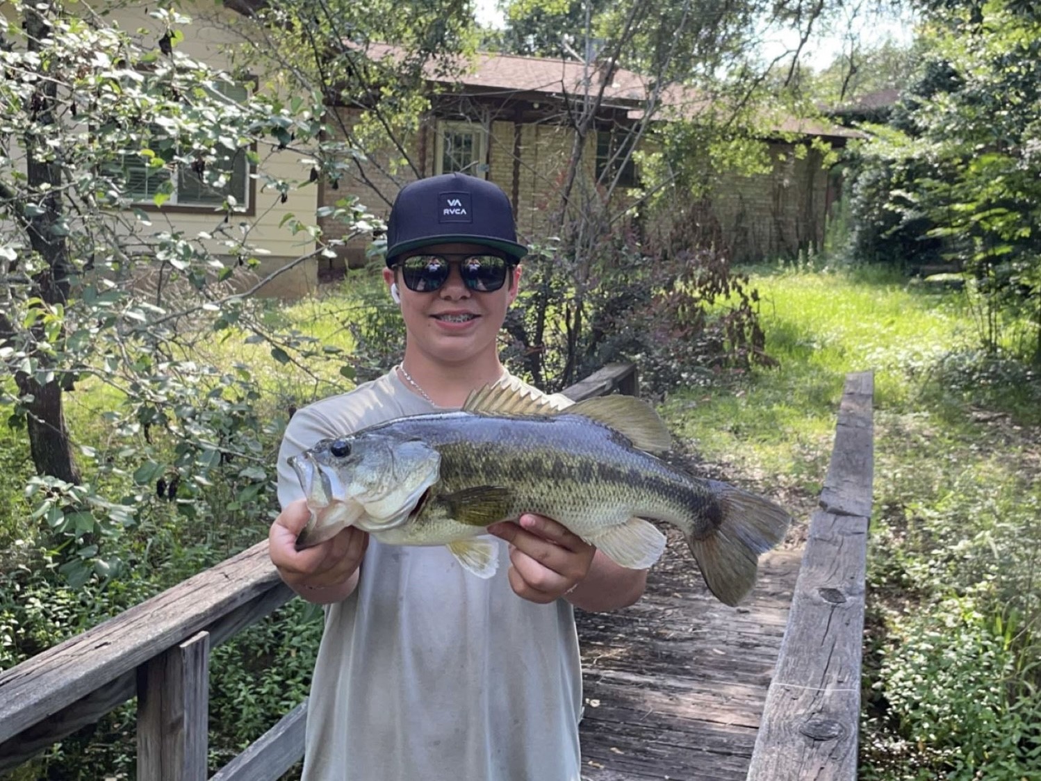 14 Veronica Lane Huntsville, TX 77340 - Photo 50 of 50 a view of a wooden fence with a bench in a patio