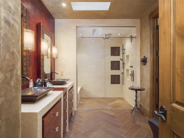 a view of a house with brick walls and flower plants