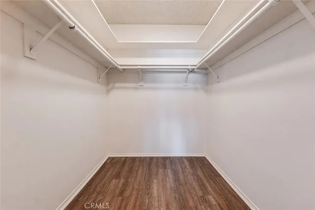 a view of a room with shelf on the wall