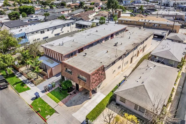 an aerial view of a house with a garden and deck