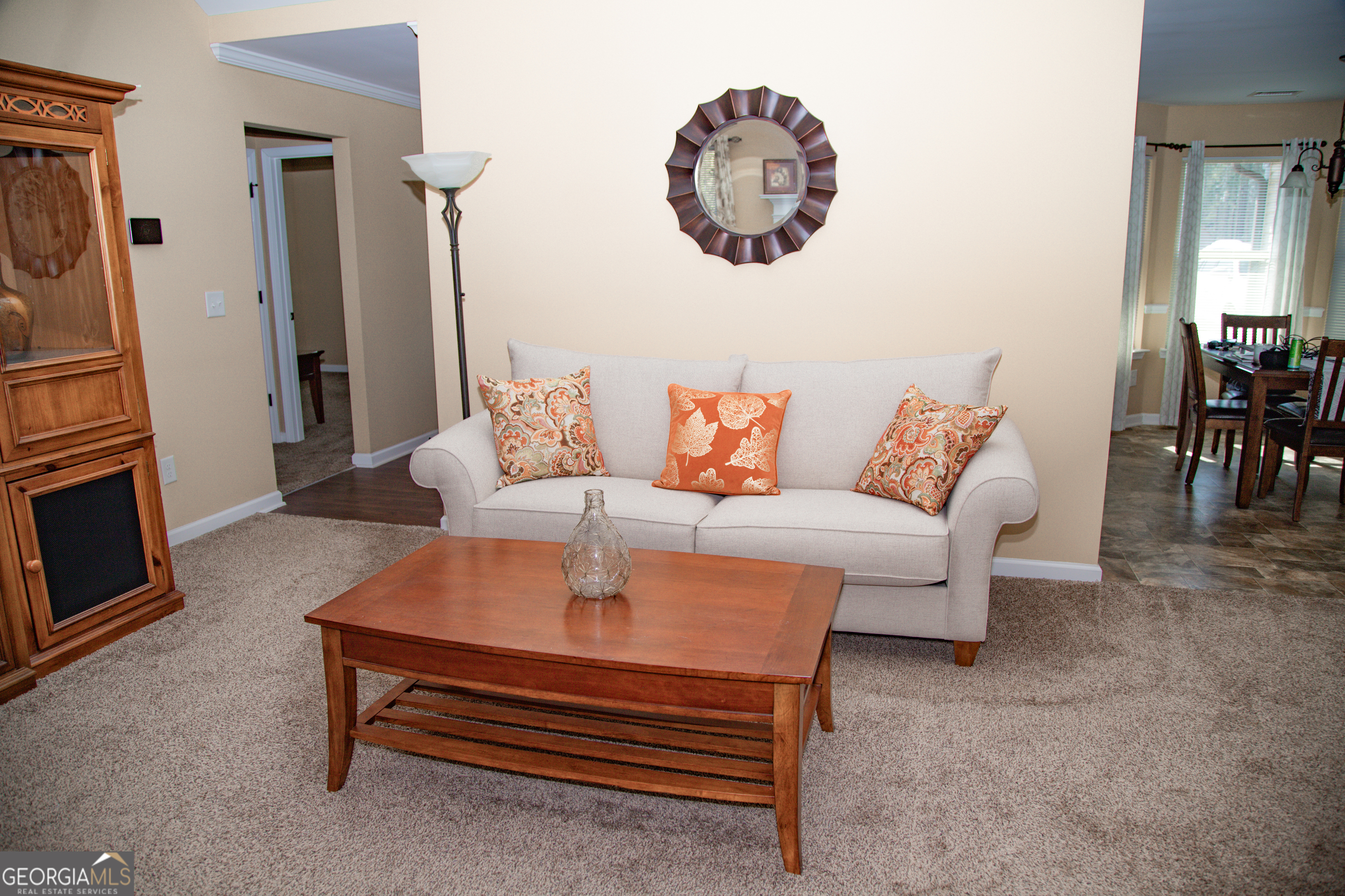 149 Bridle Path Griffin, GA 30224 - Photo 11 of 47 a living room with furniture a fireplace and a flat screen tv