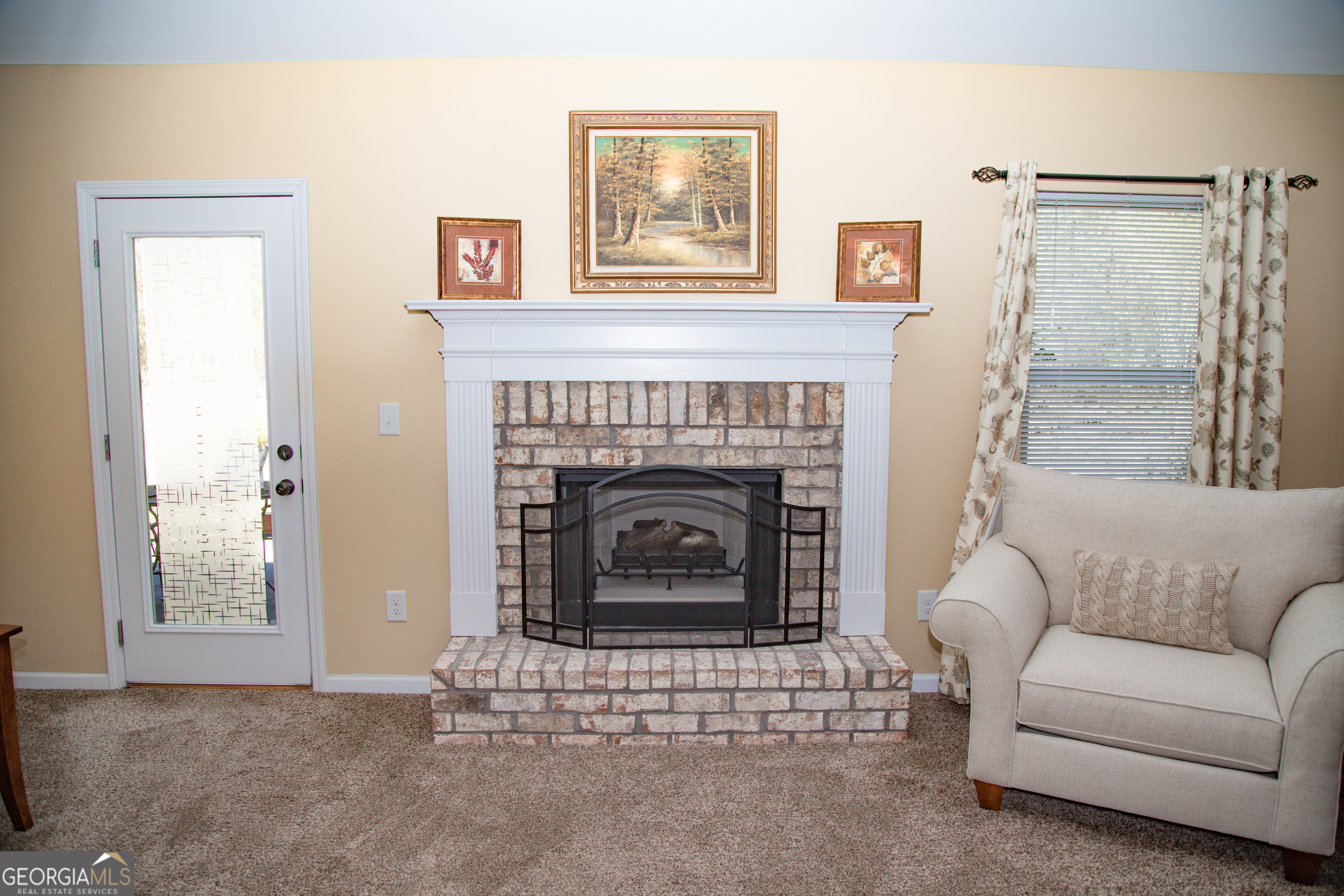 149 Bridle Path Griffin, GA 30224 - Photo 12 of 47 a living room with furniture and a fireplace