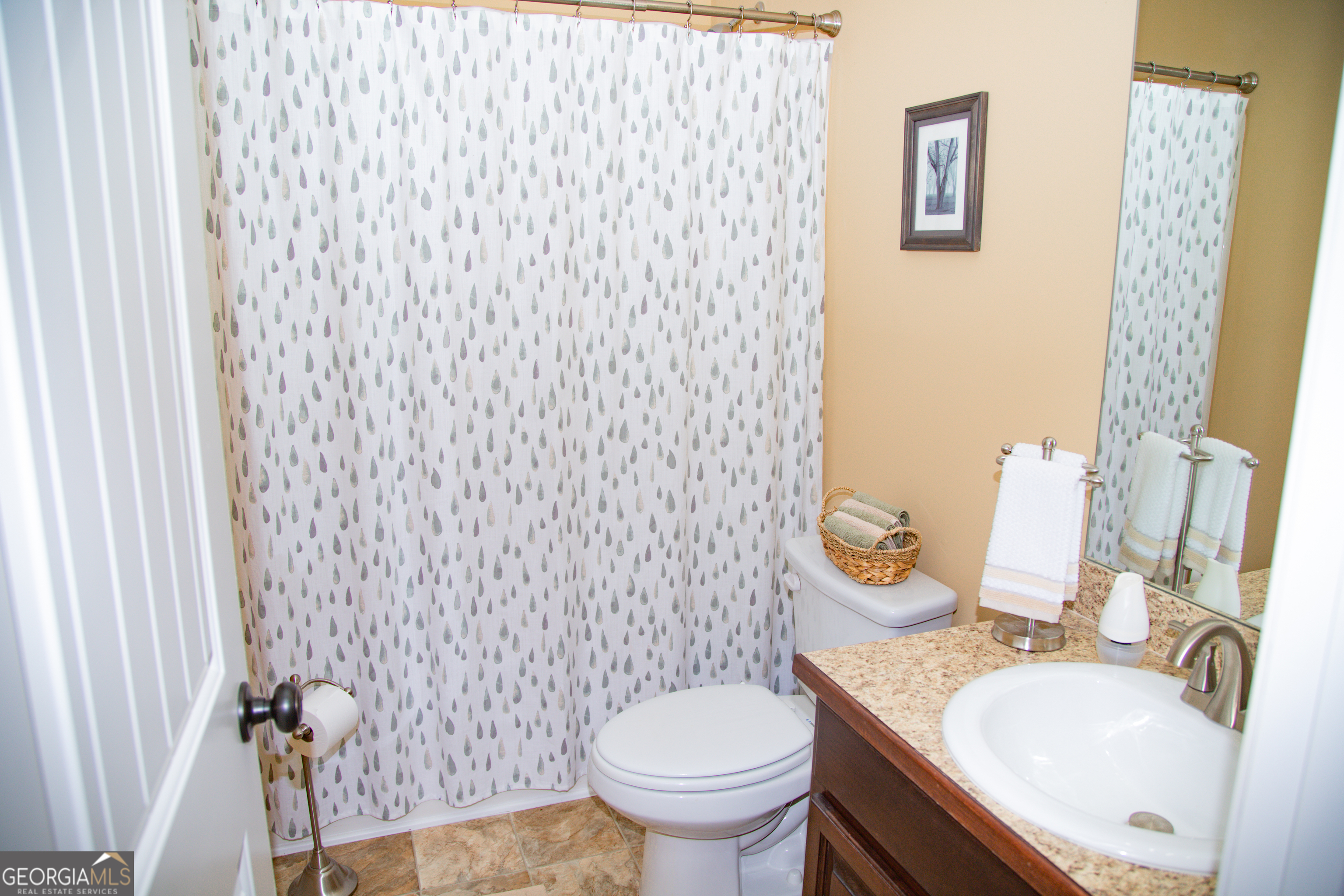 149 Bridle Path Griffin, GA 30224 - Photo 19 of 47 a bathroom with a granite countertop toilet sink and mirror