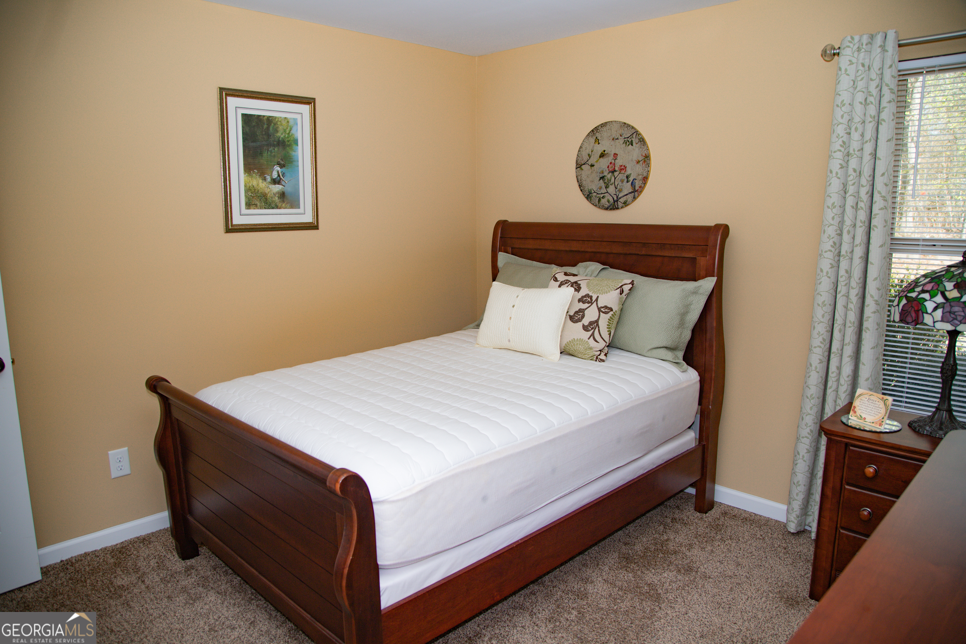 149 Bridle Path Griffin, GA 30224 - Photo 22 of 47 a bedroom with a bed and a window