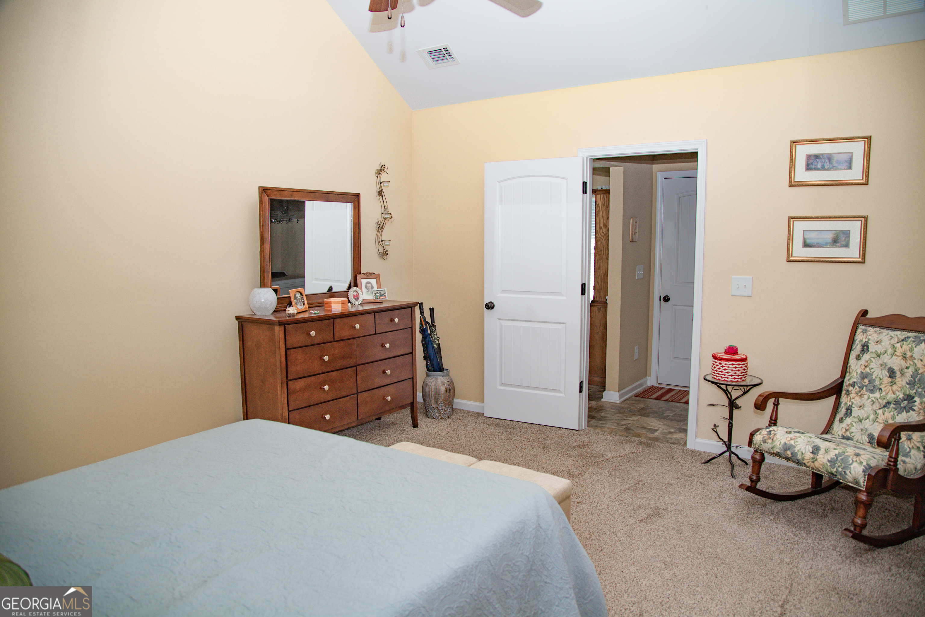 149 Bridle Path Griffin, GA 30224 - Photo 32 of 47 a bedroom with a bed and a dresser
