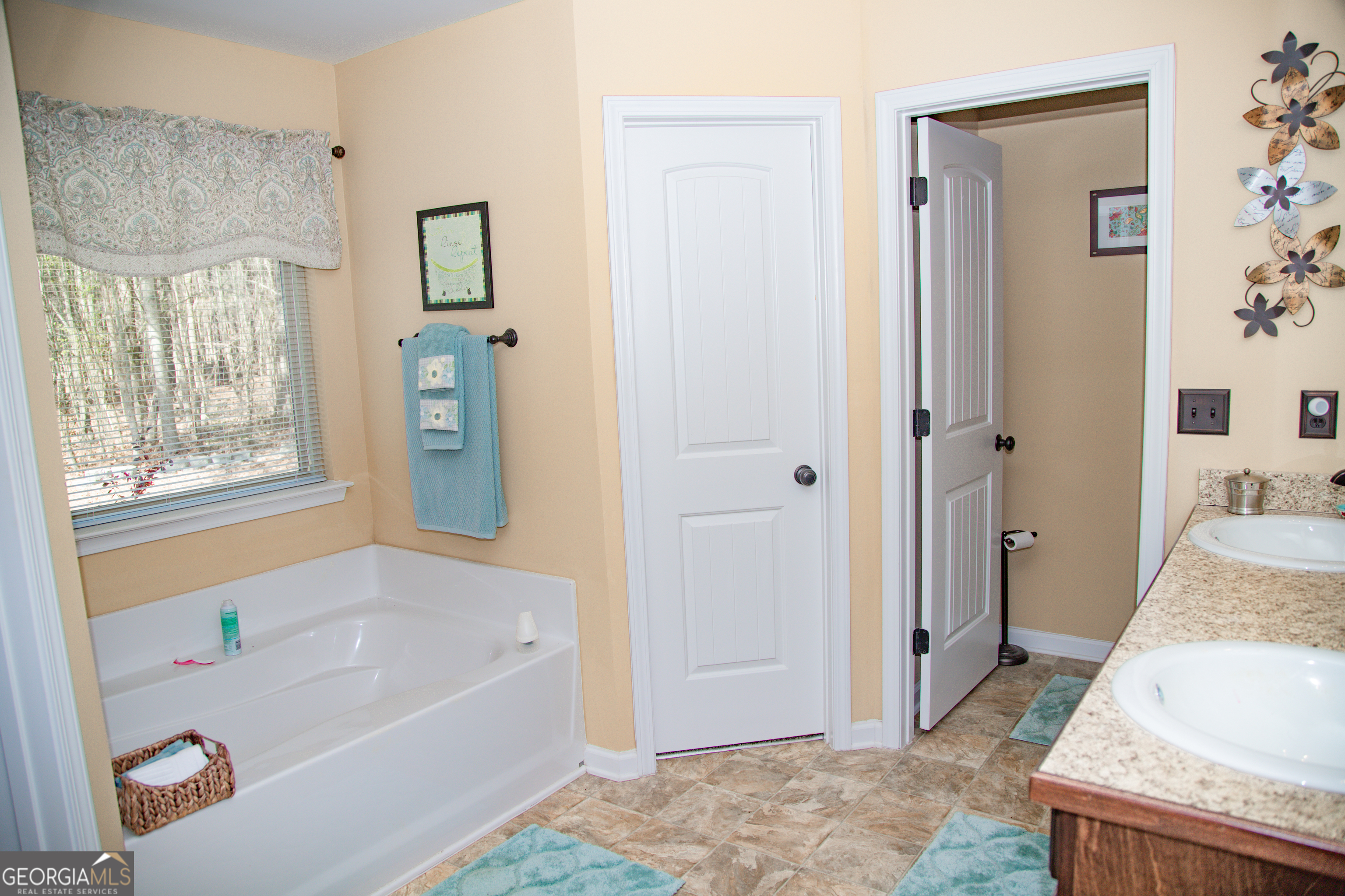 149 Bridle Path Griffin, GA 30224 - Photo 34 of 47 a bathroom with a bathtub and a shower