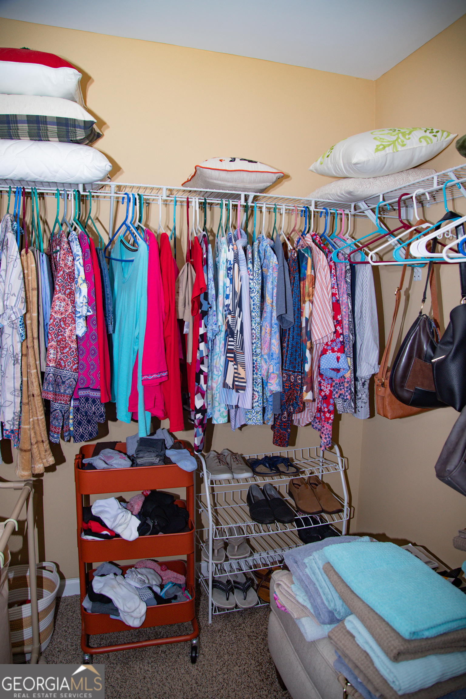 149 Bridle Path Griffin, GA 30224 - Photo 38 of 47 a view of walk in closet with clothes and shoes