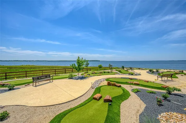 a kitchen with stainless steel appliances a sink window and cabinets