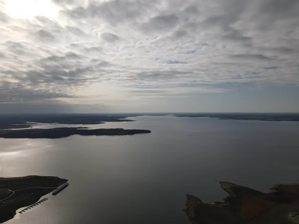 a view of a lake with outdoor seating