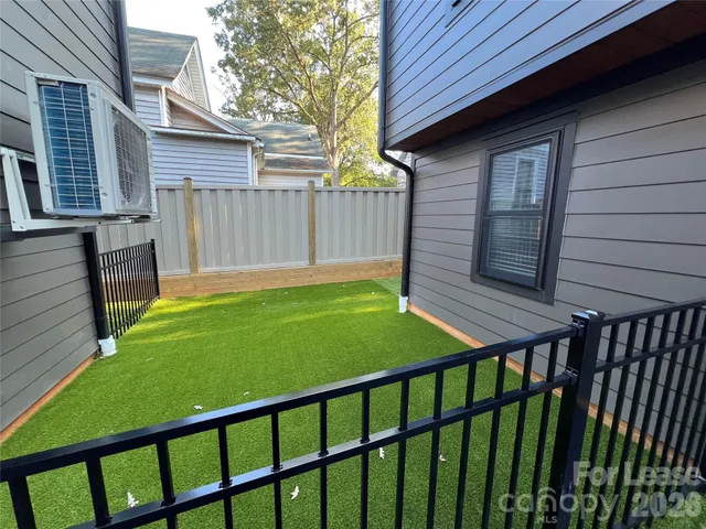 a view of a backyard with a small cabin