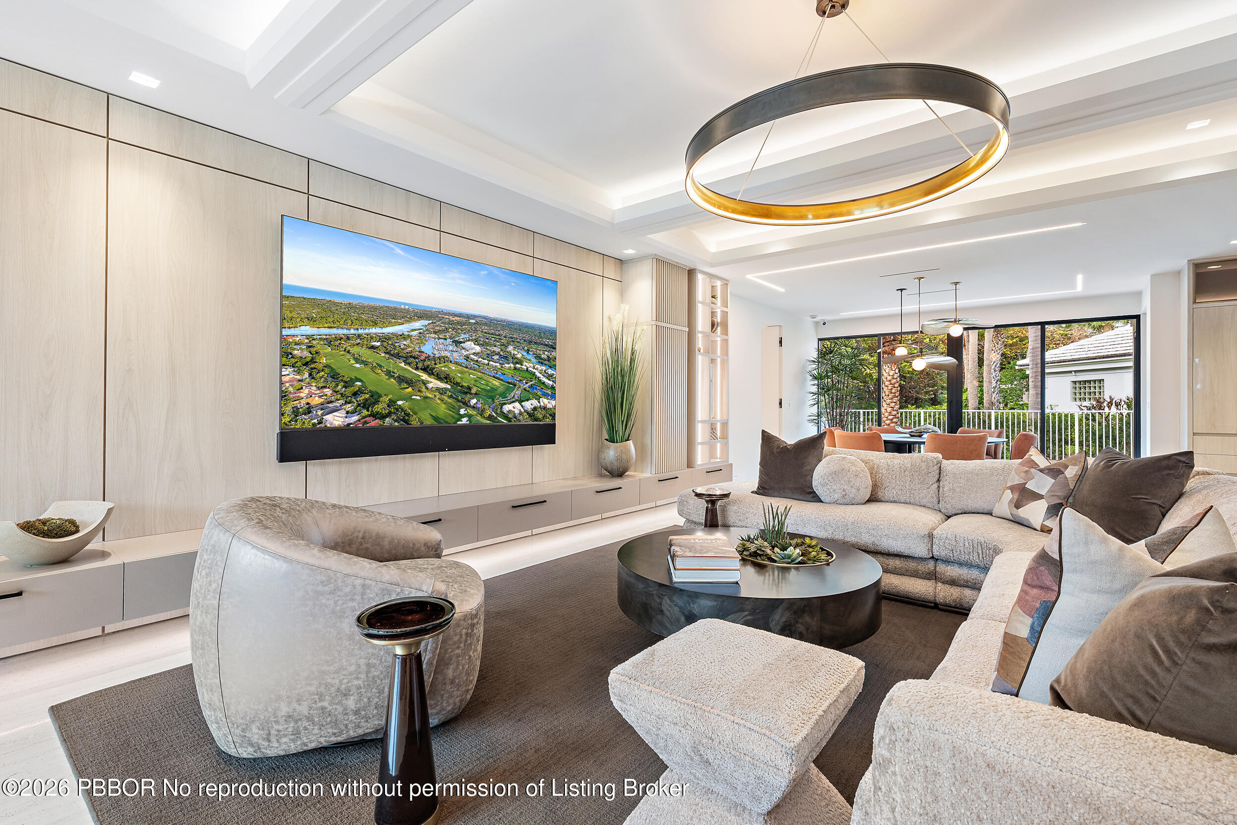 3501 Captains Way, Unit 3501 Jupiter, FL 33477 - Photo 11 of 41 a living room with furniture and a floor to ceiling window