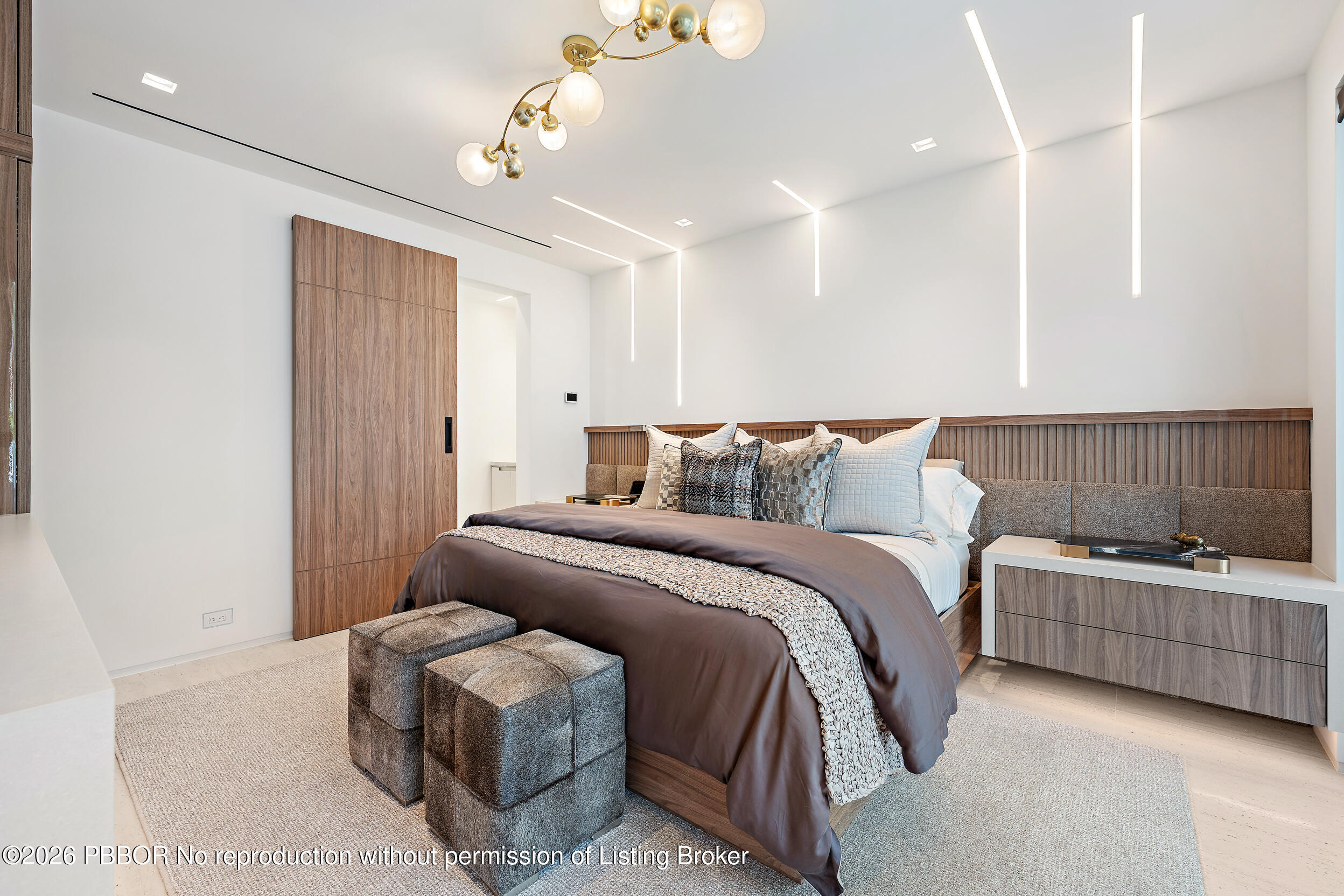 3501 Captains Way, Unit 3501 Jupiter, FL 33477 - Photo 15 of 41 a bedroom with a bed and a couch