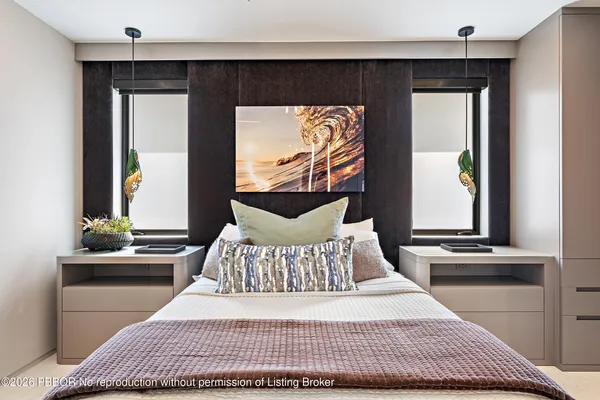 a bedroom with a bed and a couch