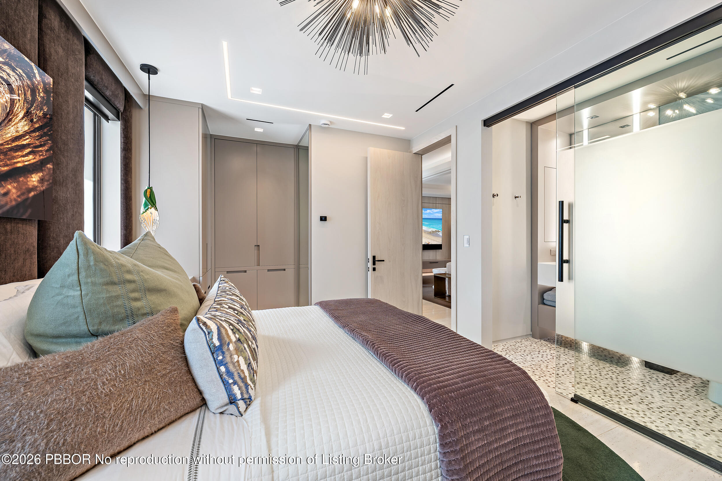 3501 Captains Way, Unit 3501 Jupiter, FL 33477 - Photo 19 of 41 a bedroom with a bed and a couch