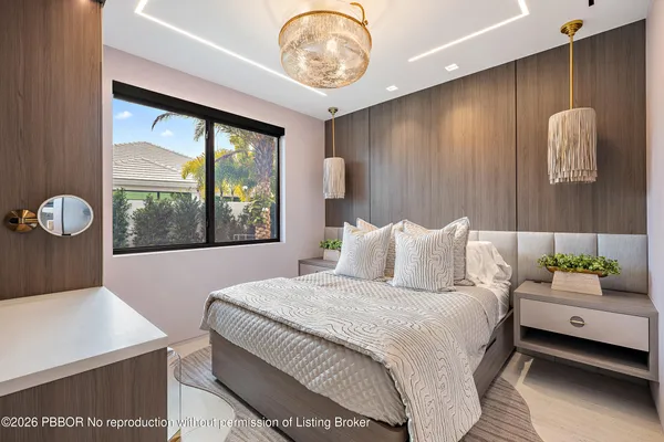 a bedroom with a large bed and a large window