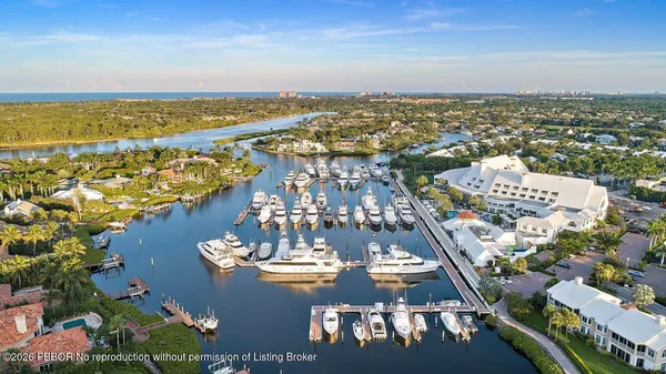 a living room with fireplace furniture and a large window