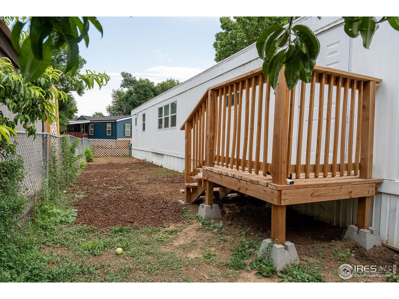 2500 East Harmony Road, Unit 456 Fort Collins, CO 80528 - Photo 20 of 22 a view of a backyard with a garden