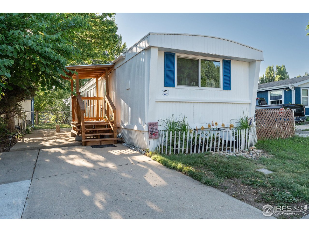 2500 East Harmony Road, Unit 456 Fort Collins, CO 80528 - Photo 2 of 22 a view of backyard with a garden and deck